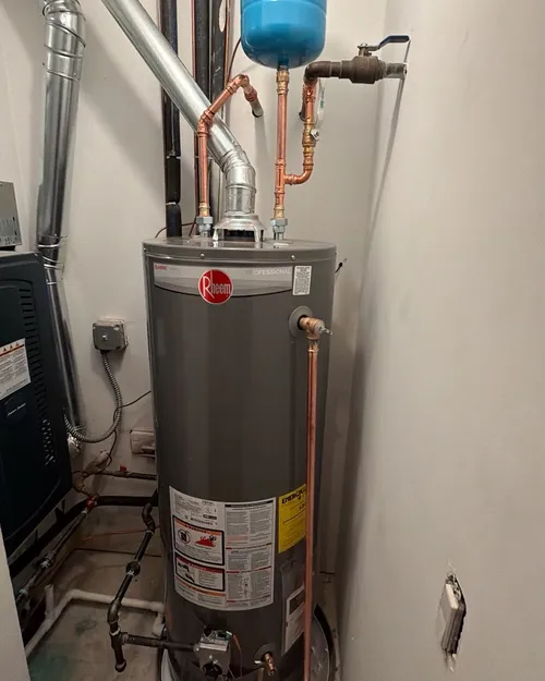 New gas water heater in a utility closet