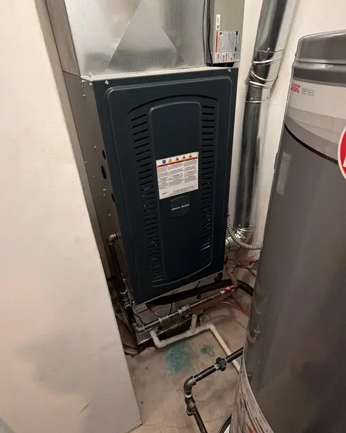 New furnace in a closet, next to the water heater
