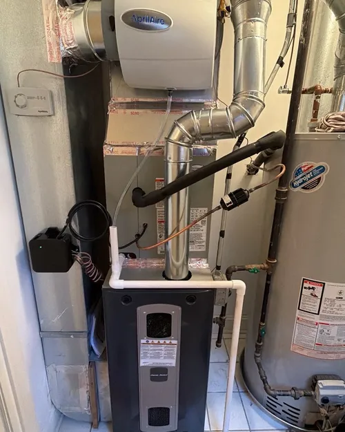 New furnace with a humidifier, next to the water heater